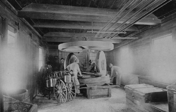 Men use a dynamite mixing machine