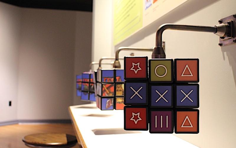 hagley-nation-of-inventors - The Ingenuity and Play section of the exhibition features giant Rubik's Cubes with images of 19th-century recreational activities-web860.jpg