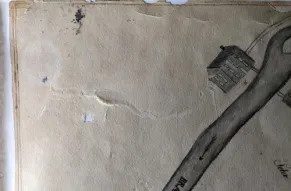 Crescent shaped creases and breaks on laminated map.jpg